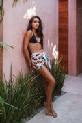 Short pink pareo with a watercolor butterfly print on a blush pink background, crafted from a lightweight cotton-silk blend for versatile beach and resort styling.