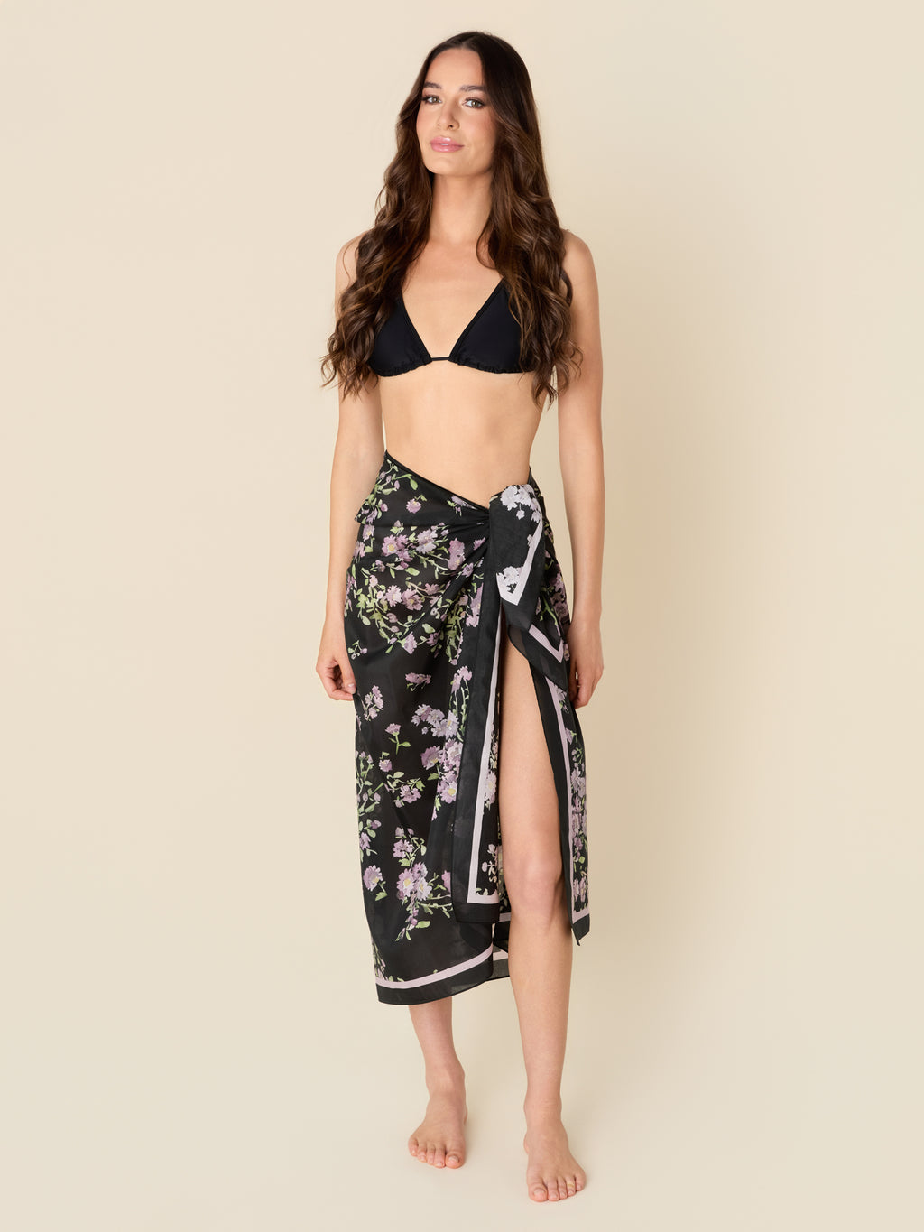 Petit Midnight black pareo cover-up with purple flowers, made from a lightweight cotton-silk blend by GEM Beach Collection.