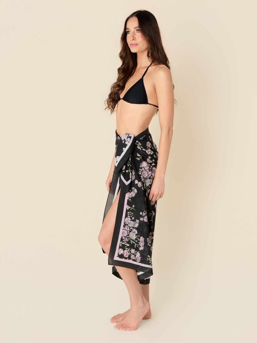 Petit Midnight black pareo cover-up with purple flowers, made from a lightweight cotton-silk blend by GEM Beach Collection.
