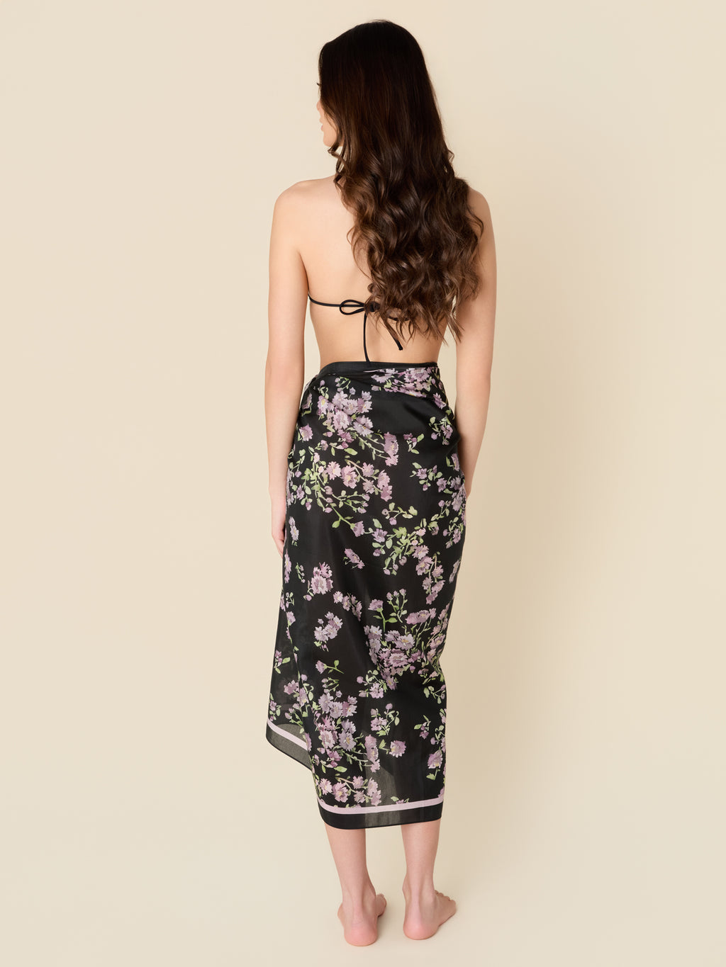 Petit Midnight black pareo cover-up with purple flowers, made from a lightweight cotton-silk blend by GEM Beach Collection.