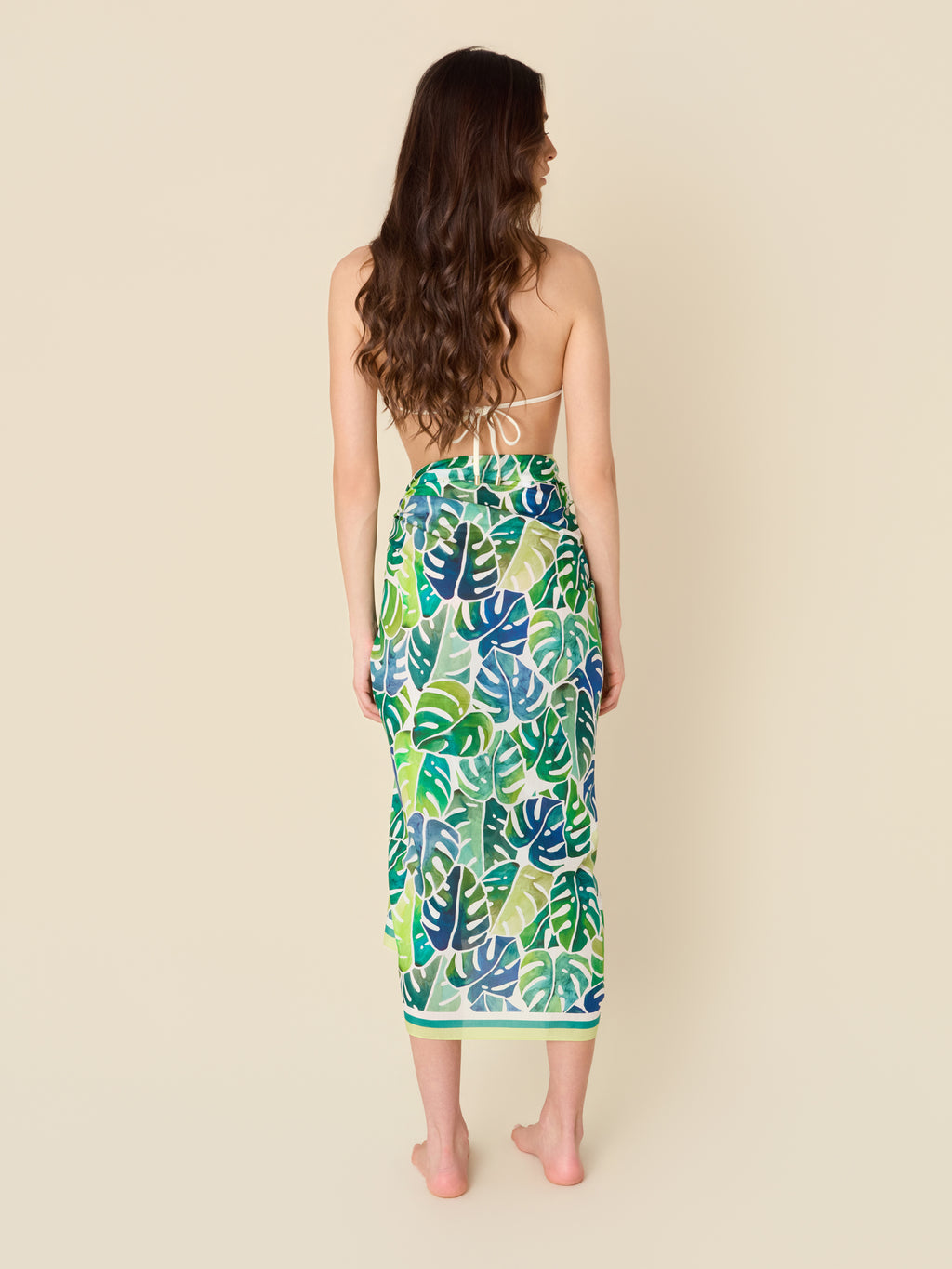Emerald Shore cotton-silk pareo beach wrap by GEM Beach Collection, featuring rich greens and blues in a coastal-inspired print.