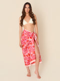 Palm Rouge pareo cover-up with pink and red palm leaves, made from a lightweight cotton-silk blend by GEM Beach Collection.