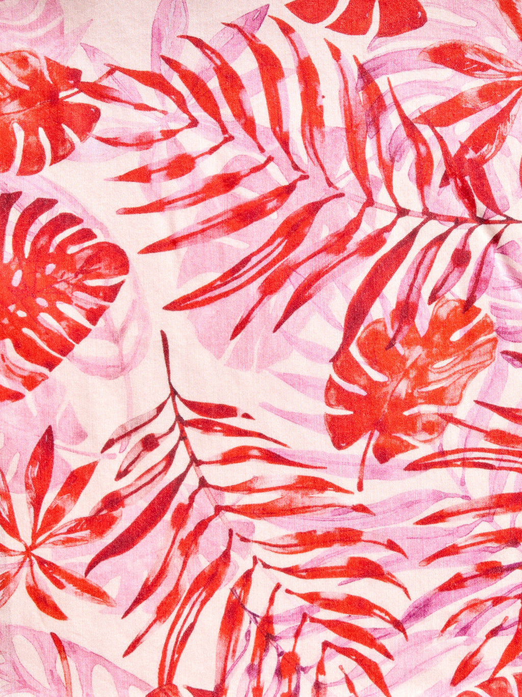 Palm Rouge pareo cover-up with pink and red palm leaves, made from a lightweight cotton-silk blend by GEM Beach Collection.