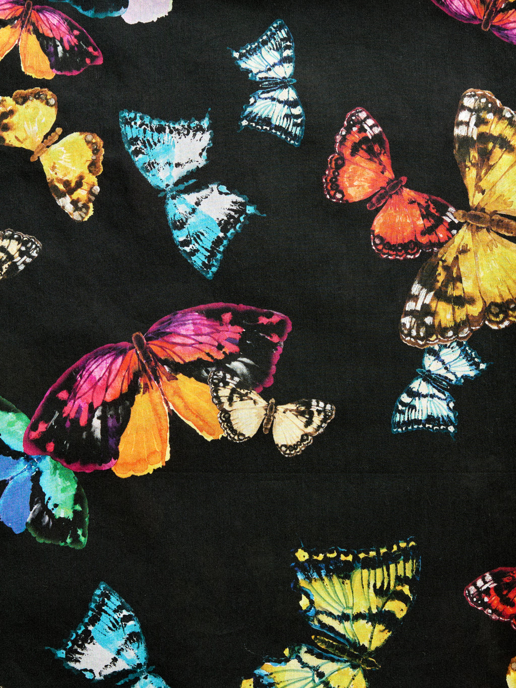 Whisperwing Black black pareo cover-up with watercolor butterfly details, made from a lightweight cotton-silk blend by GEM Beach Collection.